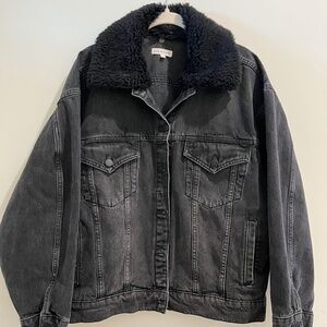 Good American washed black trucker jacket with faux fur collar